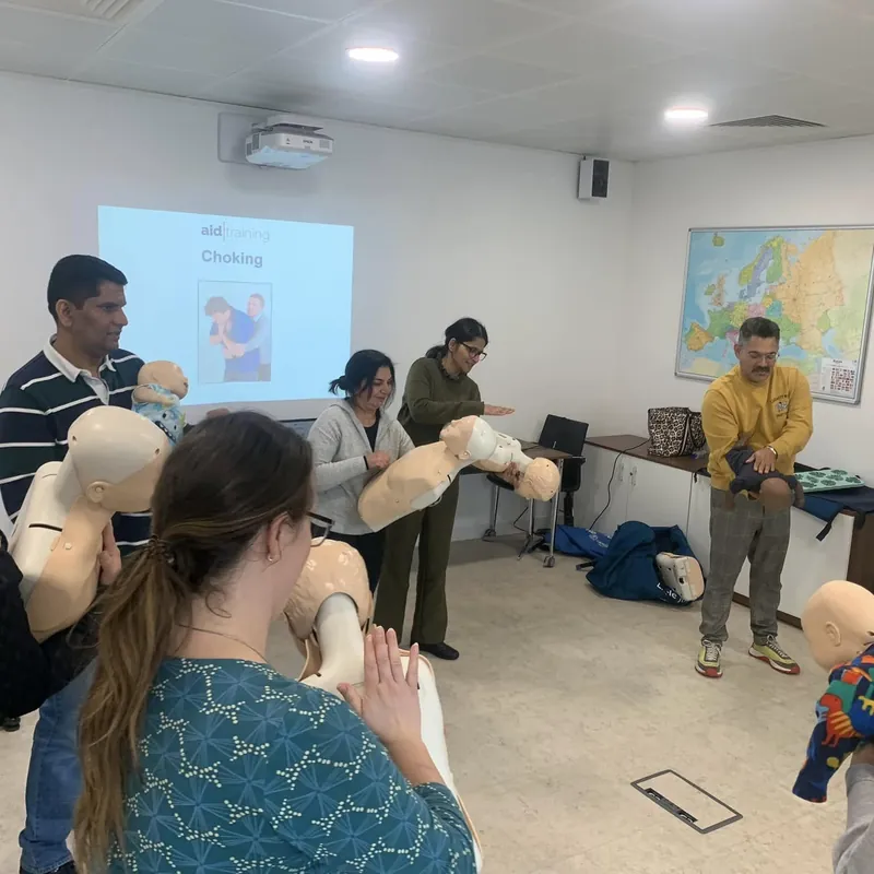 Infant choking practice with the slide on screen