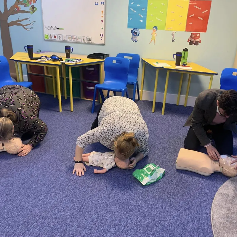 Paediatric CPR practice on child manikins in a classroom