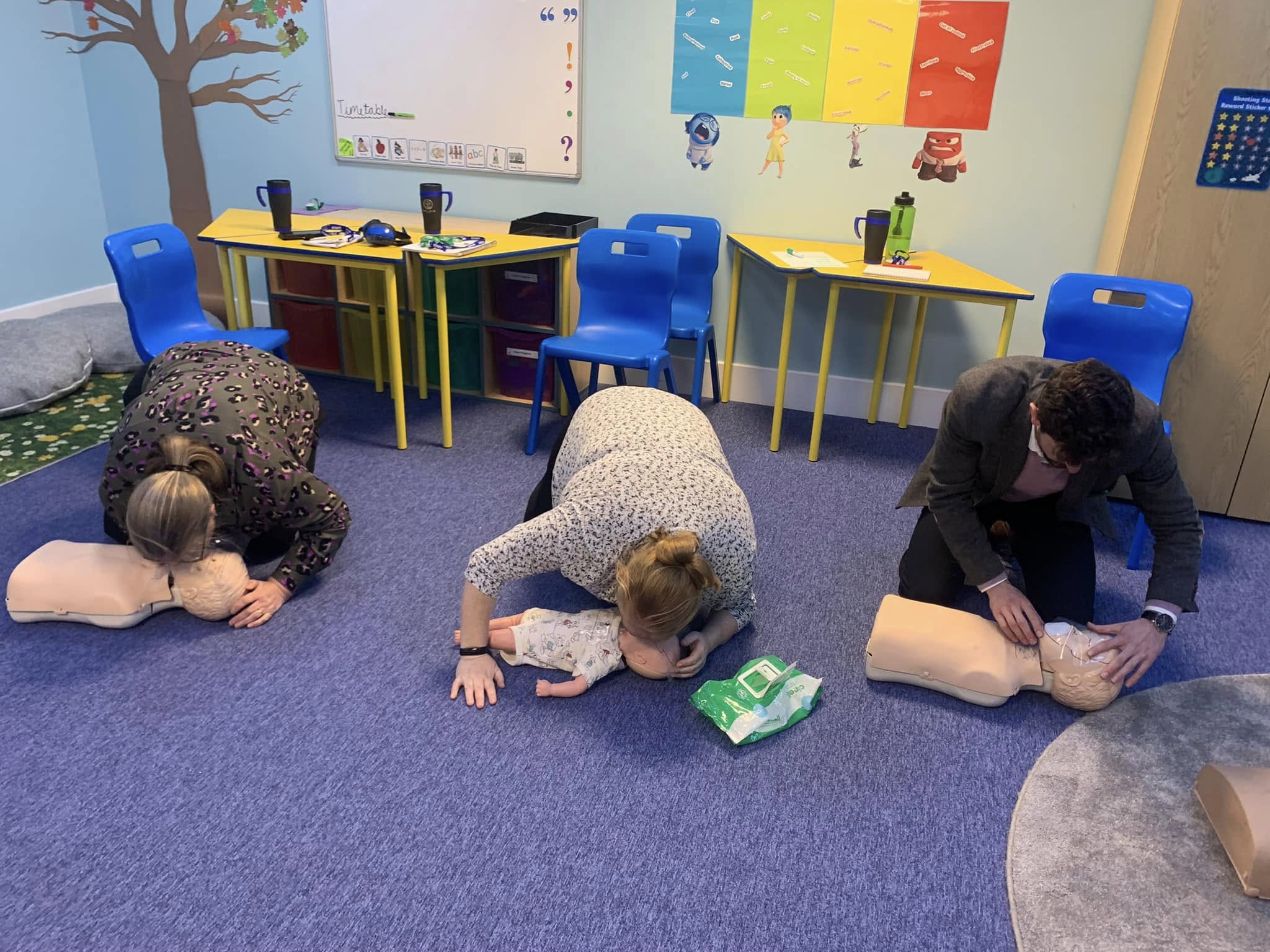 Paediatric CPR practice on child manikins in a classroom